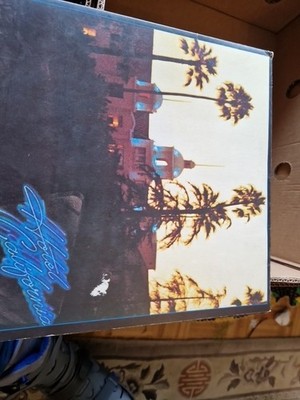 The Eagles Hotel California Vinyl LP signed by Henley Frey Felder Walsh Meisner