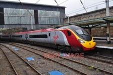 PHOTO  VIRGIN TRAINS PENDOLINO A SERVICE ON THE WEST COAST MAINLINE THAT CALLS A
