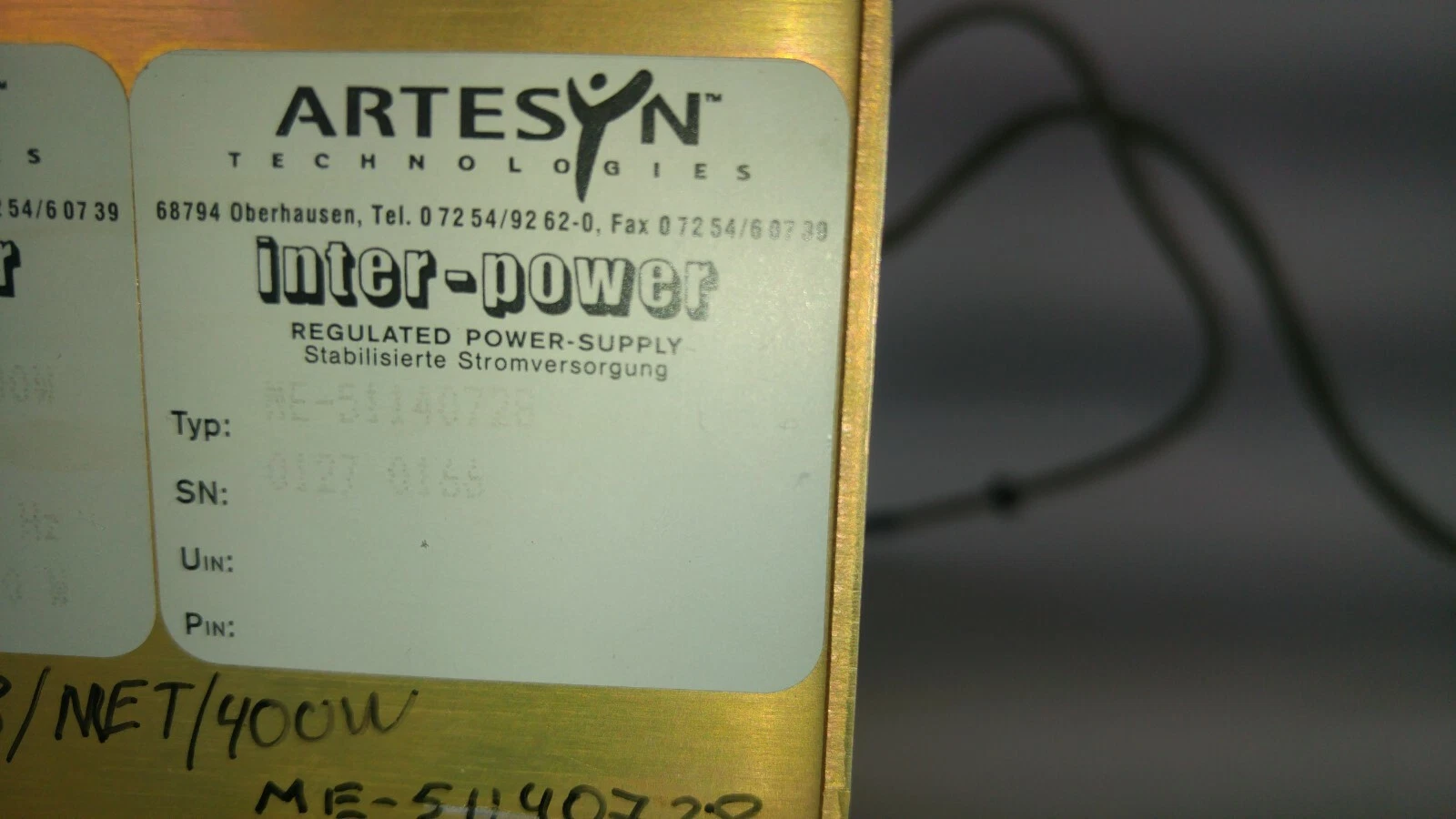 Artesyn label with type ME-51140728, regulated power supply