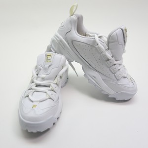 white and gold fila shoes