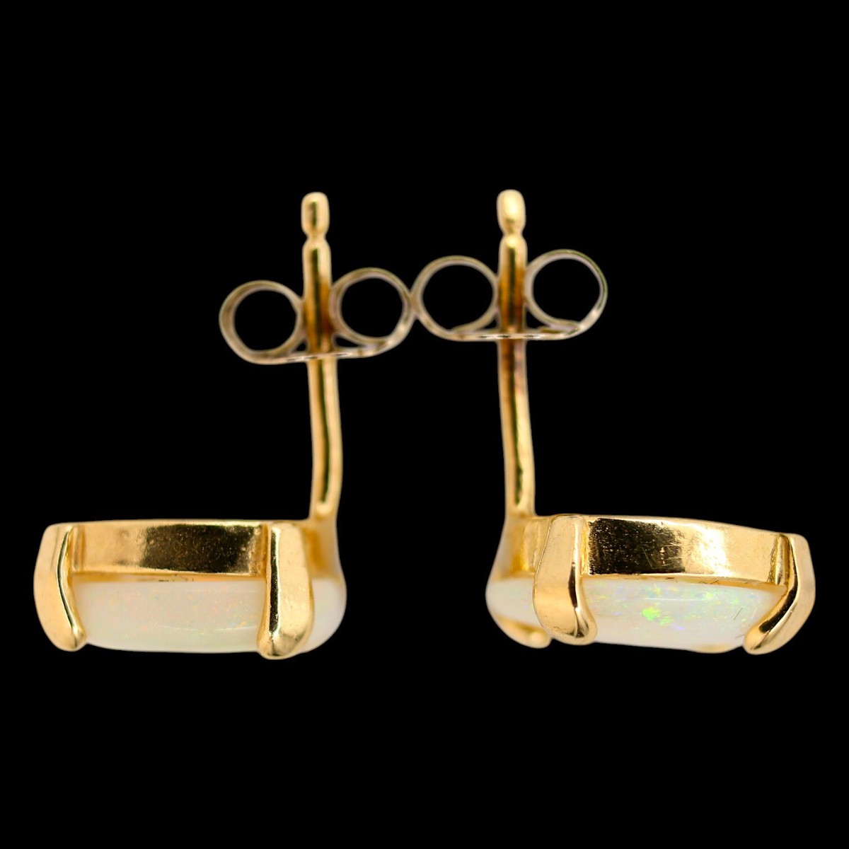 Pair of estate 14K yellow gold opal stud earrings