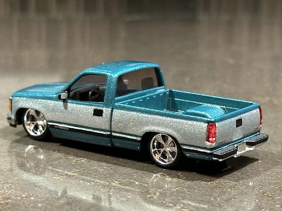 M2 Machines 1989 GMC Sierra 1500 LT4 Custom Lowered Teal x Silver TWO-TONE 1:64 - Image 2 of 4