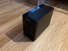 QNAP TS-251+ with 1TB BARACUDA HDD and power adapter.
