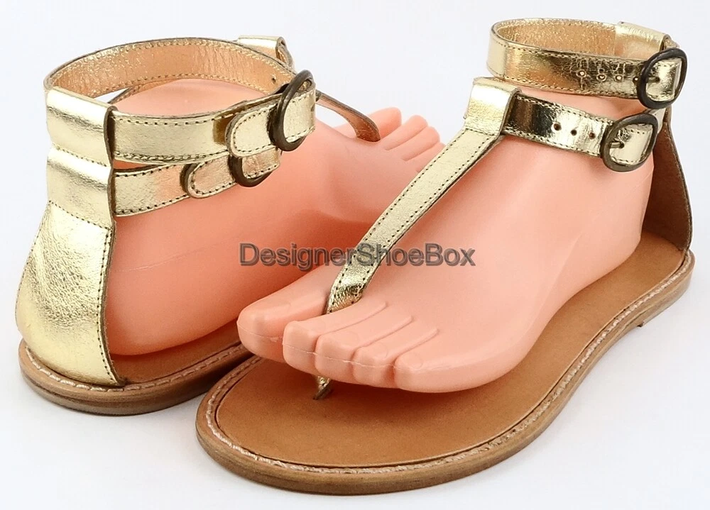 Designer gold hotsell flat sandals