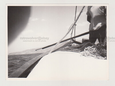 Photographer's Fumbling Finger Faceless Man on Ship Vast Open Sea Abstract Photo