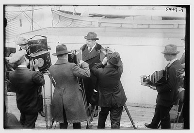 Photo:John McCormack with Photographers and Cameras 1921