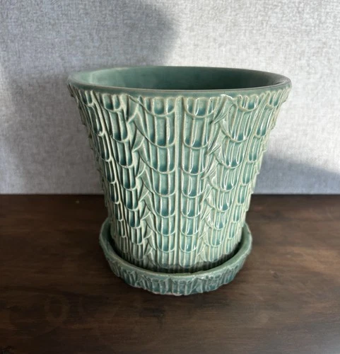 Vintage Nelson McCoy pottery planter with a fish scale design in an aqua glaze.