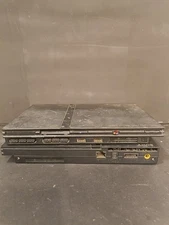 Lot of two playstation 2 slim consoles, no cords, no controllers.
