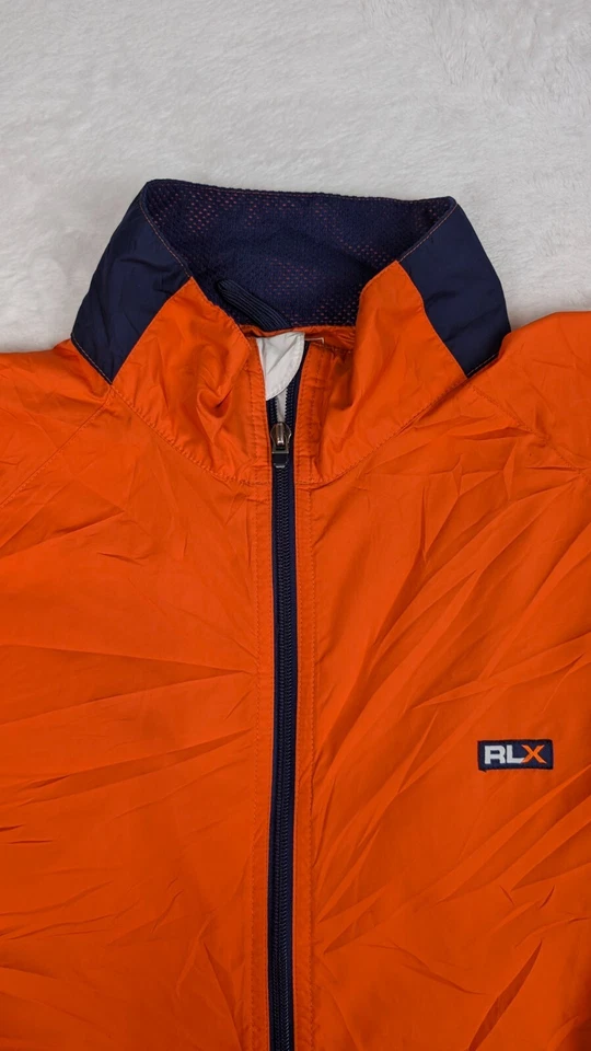 Chaqueta cortavientos deportiva RLX Polo para hombre grande naranja empaquetable Foto 3 de 4