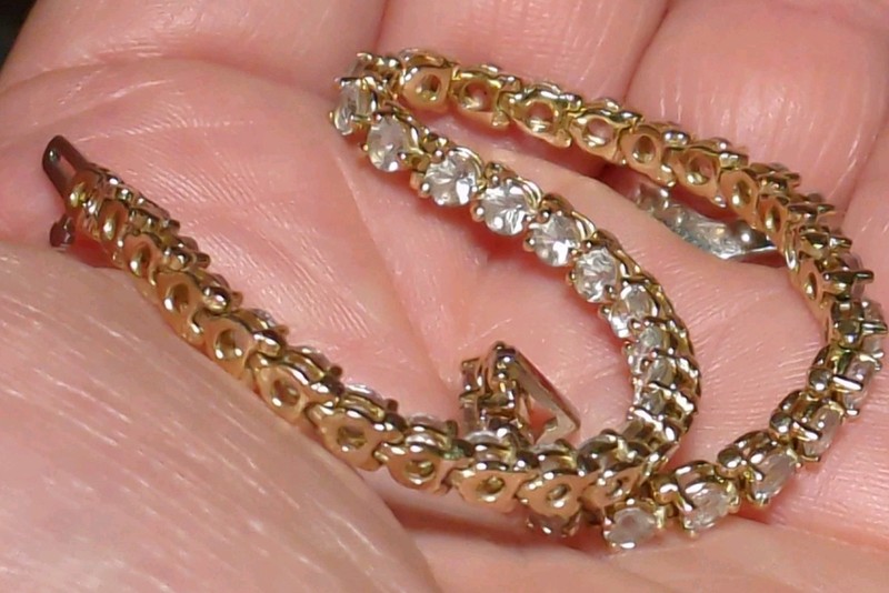 14K stamped tennis bracelet with white stones. 