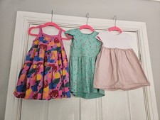 3 summer dresses age 12-18 months from Next & Mothercare. Multicoloured pink
