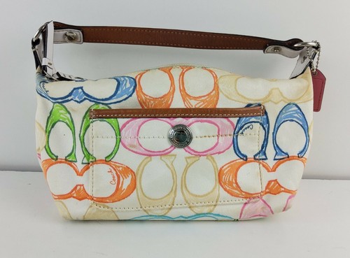white coach bag with multi colored c's