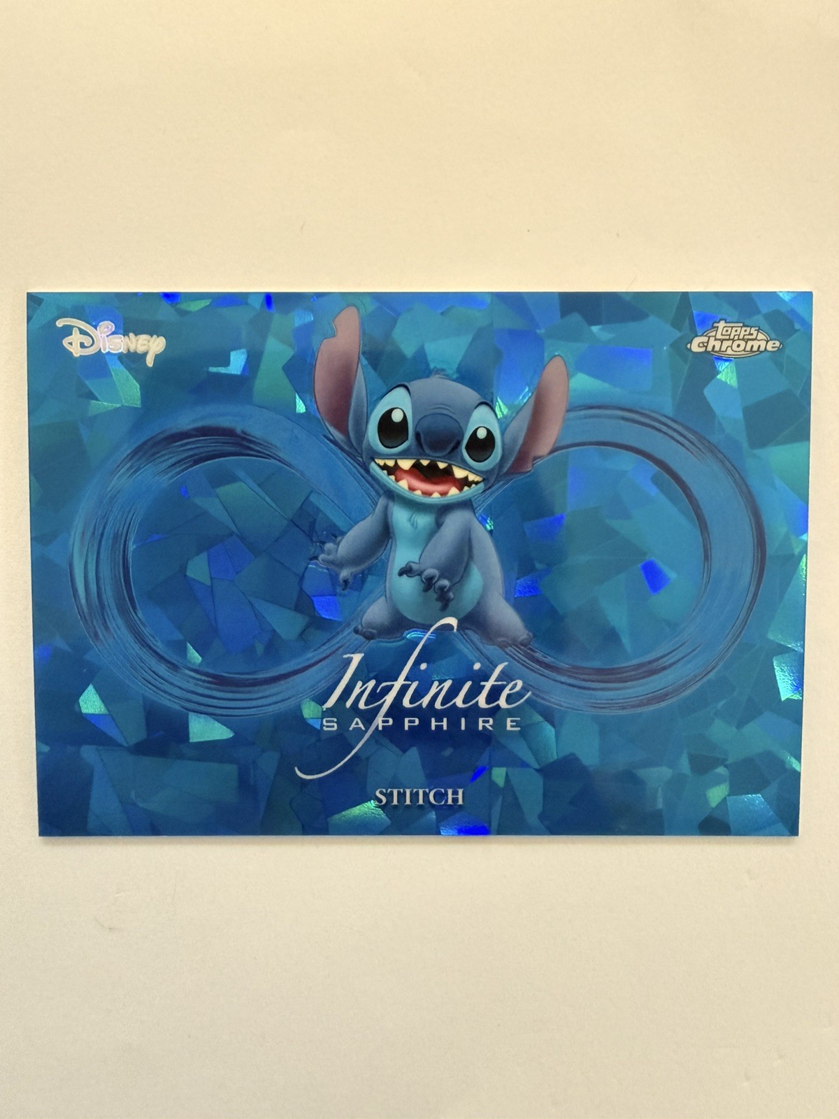 Stitch #IS-9 2026 Topps Chrome Sapphire Disney Infinite trading card — raw and PSA graded price guide