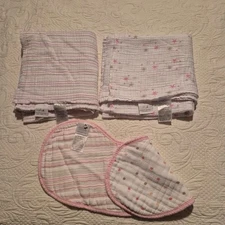 Aden + Anais 2 muslin swaddles 1 striped 1 has stars 1 cotton muslin burpy bib