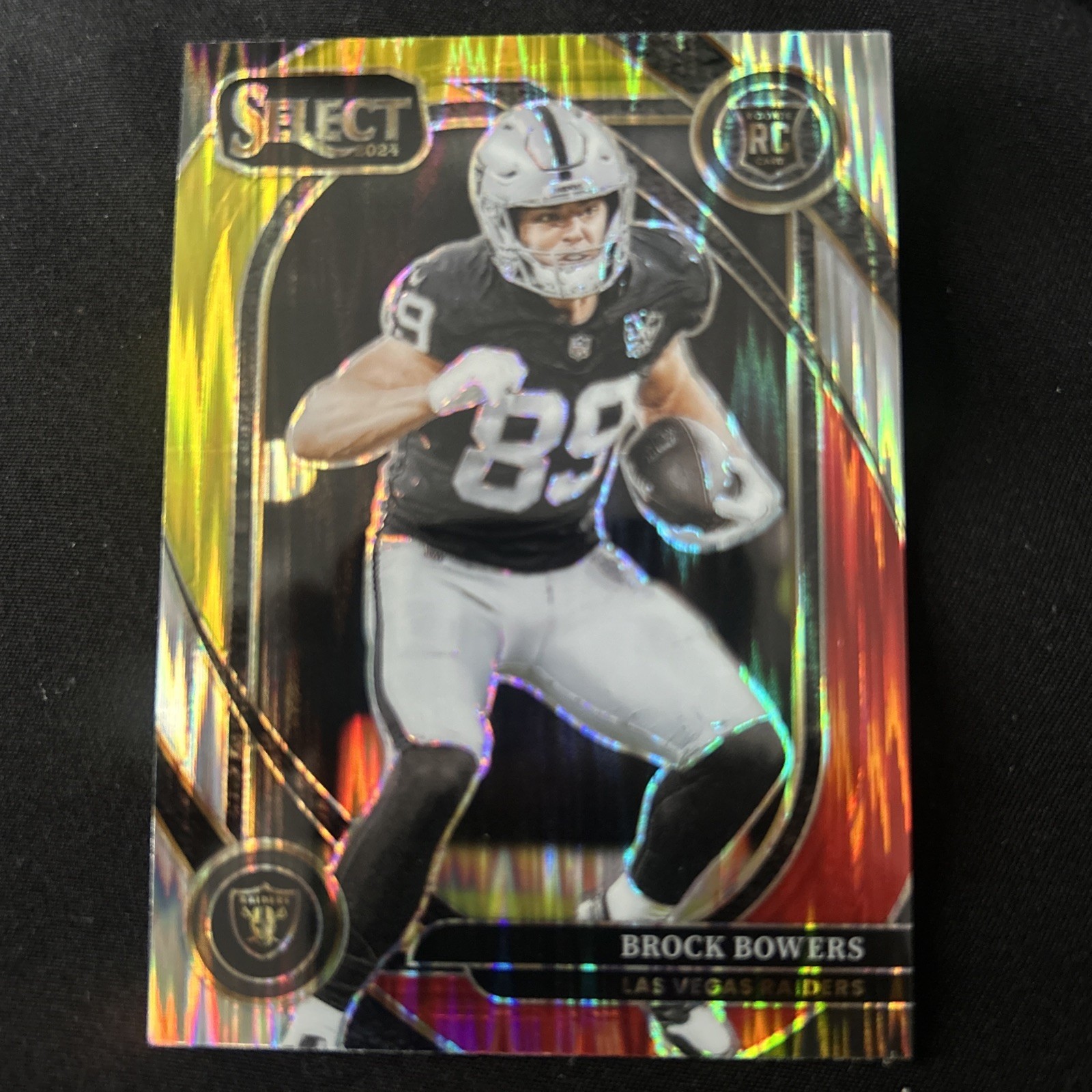 2024 Panini Select - Club Level Brock Bowers #222 Red & Yellow Shock Prizm (RC)