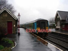 PHOTO  CLASS 156 UNIT 156486  DEPARTS FROM HORTON STATION THE TRAIN IS FORMED OF