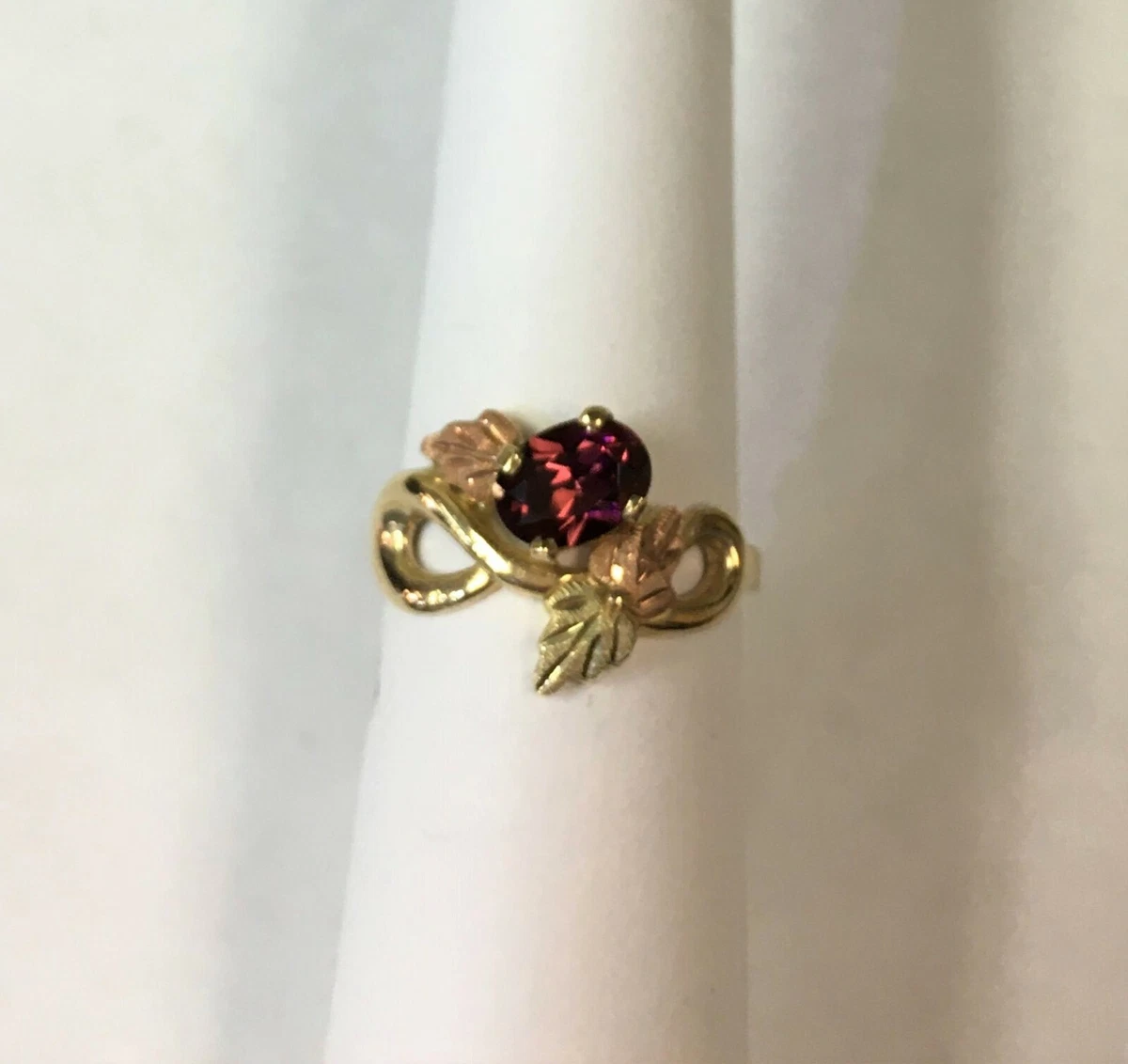 10k Black Hills Gold style Ring set with oval Garnet Size 6.25