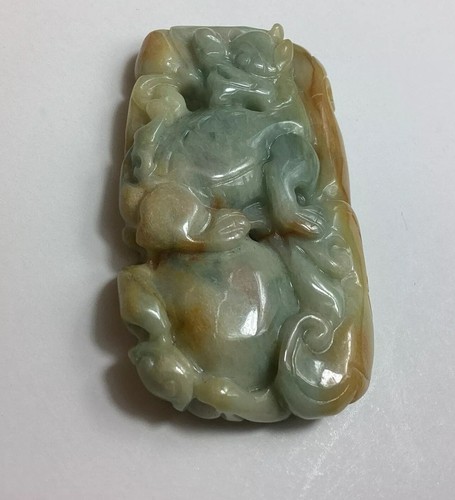 Multi Toned Two Sided Jadeite Foo Dog & Lucky Treasure Bag Translucent Pendant