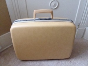 yellow hard shell luggage