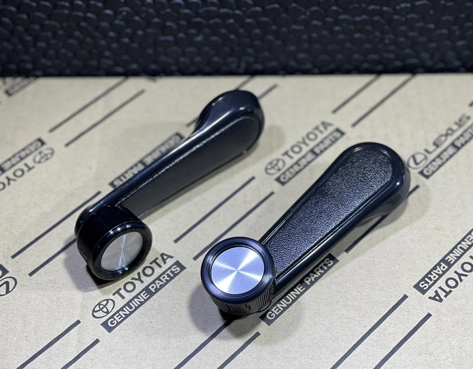 81-87 TOYOTA LAND CRUISER FJ60 BJ60 JUEGO DE MANIVELA DE VENTANA DE PUERTA DELANTERA OEM NUEVO Foto 2 de 4