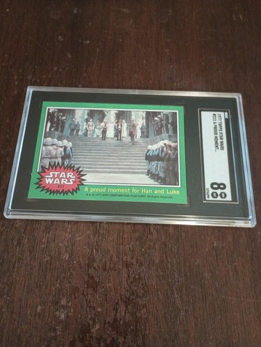 1977 Topps Star Wars #211 A proud moment for Han and Luke