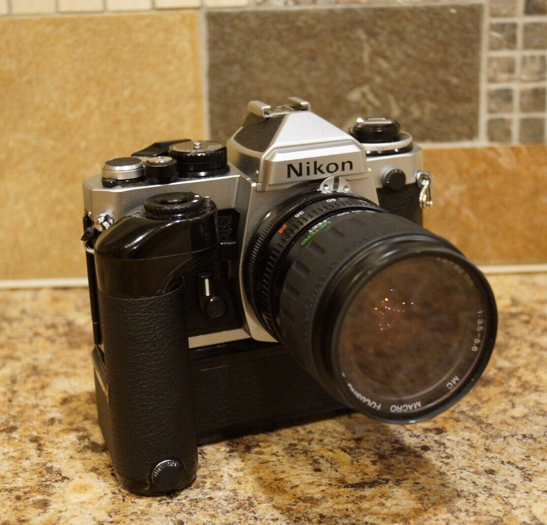 Nikon FE2,Nikon MD-12,Vivitar 28-80mm Zoom.Everything Works.READ