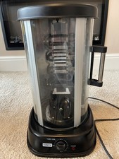 Tower vertical rotisserie grill with 360 degree rotating spit