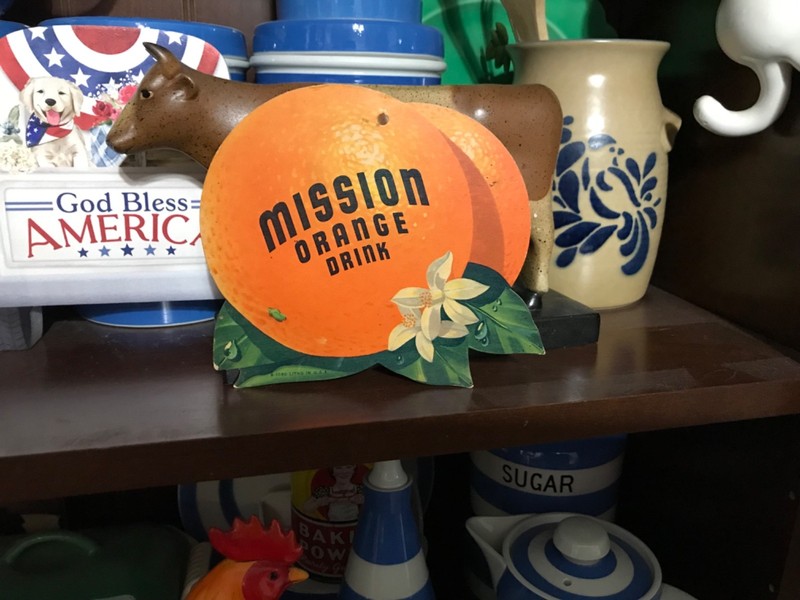1950’s Mission Orange cardboard die cut with hole for hanging as a fan pull