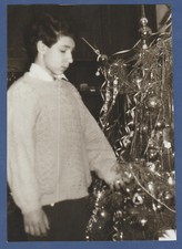Handsome guy near the Christmas tree in the house. Soviet Vintage Photo USSR