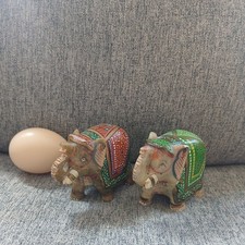 pair of small elephant ornaments, made of stone and painted