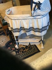 Delta Children Gliding babyBassinet slightly used, blue and white for baby boy