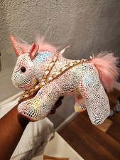 sparkly pink and white plush unicorn crossbody purse featuring a metallic scale