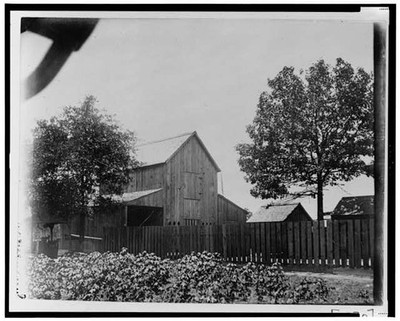 Photo:Barn,other buildings behind fence in Georgia