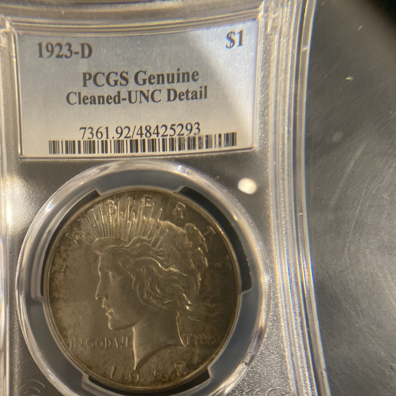 B.U. SILVER PEACE 1923D PCGS CLEANED UNC. DETAIL
