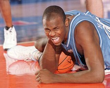 Brendan Haywood of North Carolina grimaces in pain after falling t- Old Photo 1
