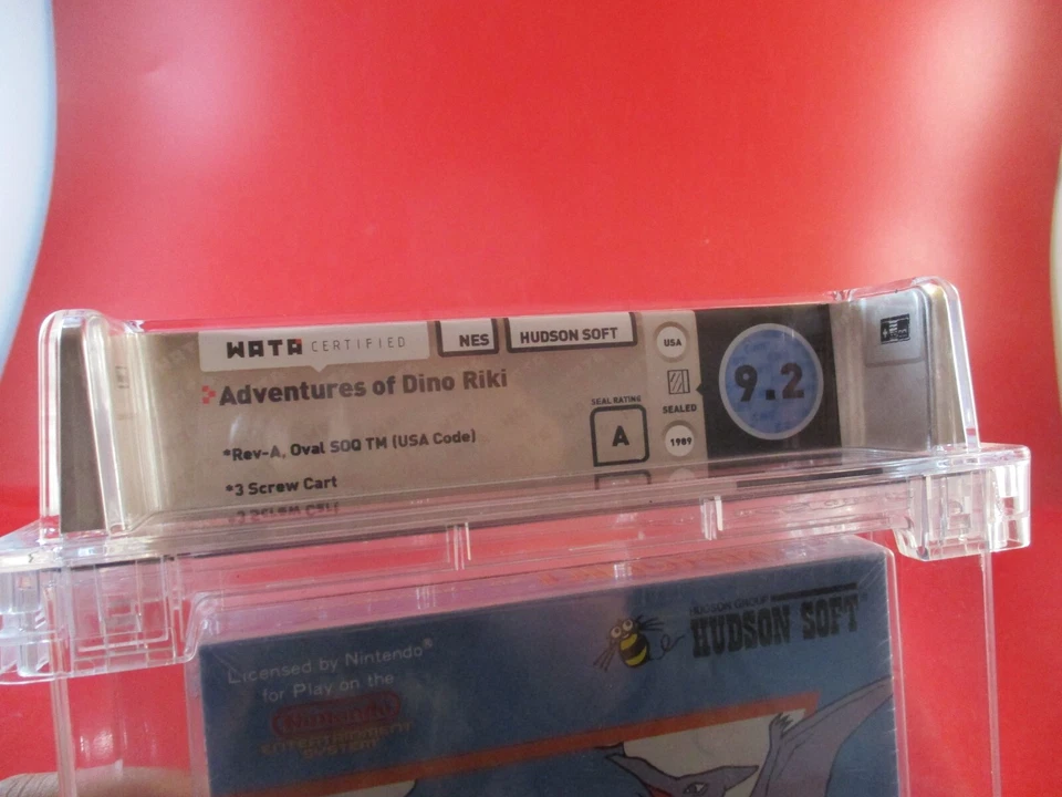 Adventures of Dino Riki (Nintendo NES) **NUEVO** ¡Sellado! WATA 9.2 A *estuche dañado* Foto 2 de 4