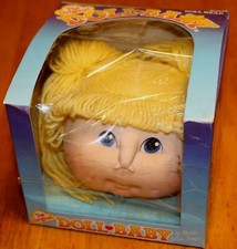 Fibre Craft: DOLL BABY DOLL HEAD - YELLOW/BLONDE PIGTAIL HAIR BLUE EYES 3108-01