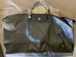 branded leather duffle bag