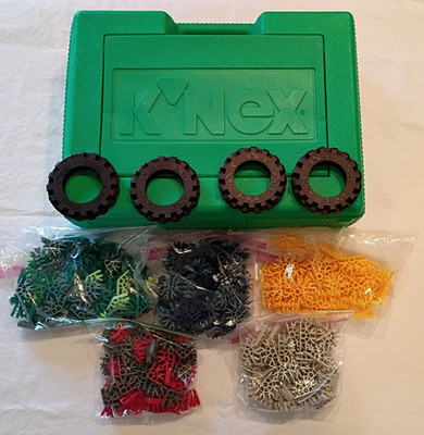Group of K'NeX in carry case- 3-way, 4-way, 5-way, 7-way connectors, large tires
