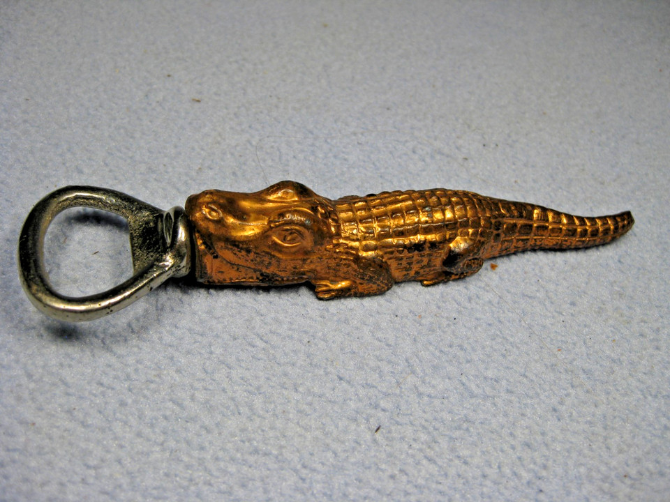 A hand-crafted alligator bottle opener with built-in corkscrew from Japan — 5.5 inches of pure conversation-starting vintage weird.