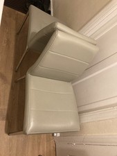 Two grey dining table chairs