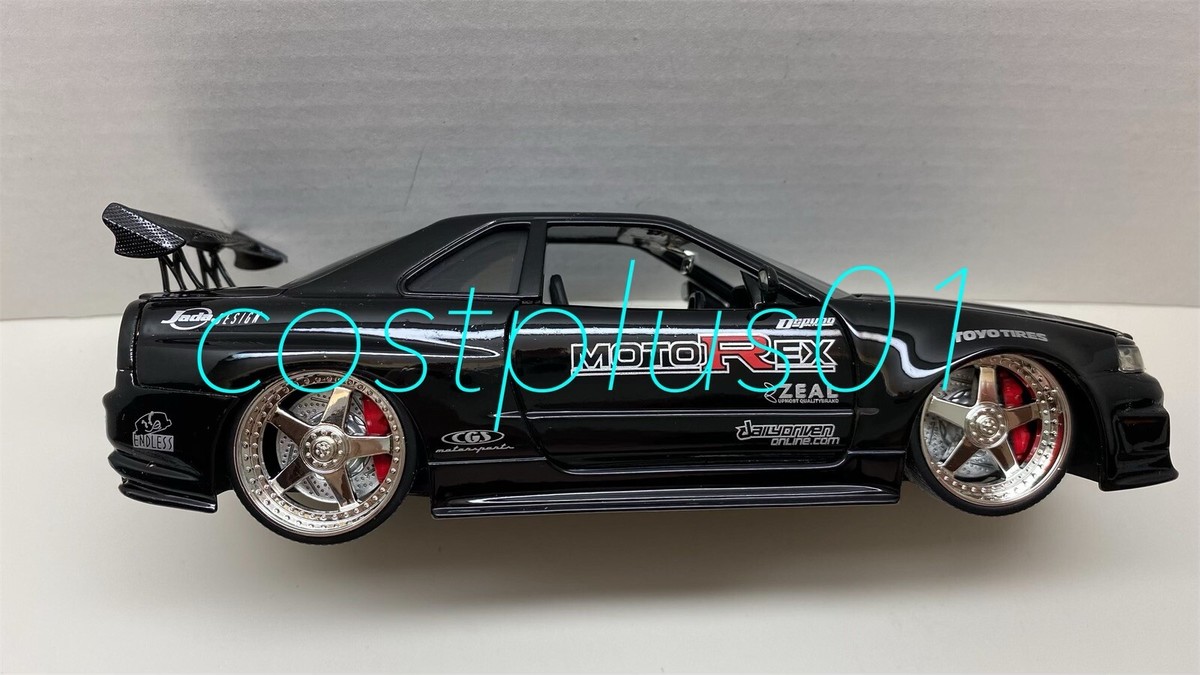 ミニカー NISSAN SKYLINE GT-R R34 jadatoys JADA DUB CITY 2002 NISSAN SKYLINE GT R R34 1:24 RED MOTOREX