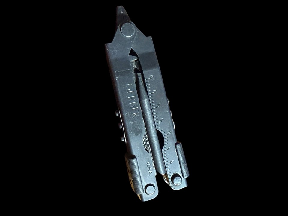 The Gerber Center Drive is legendary for its center-axis screwdriver — a genuinely clever mechanical design that most multi-tool fans geek out over, and this black tactical USA-made version is a serious collector's piece.