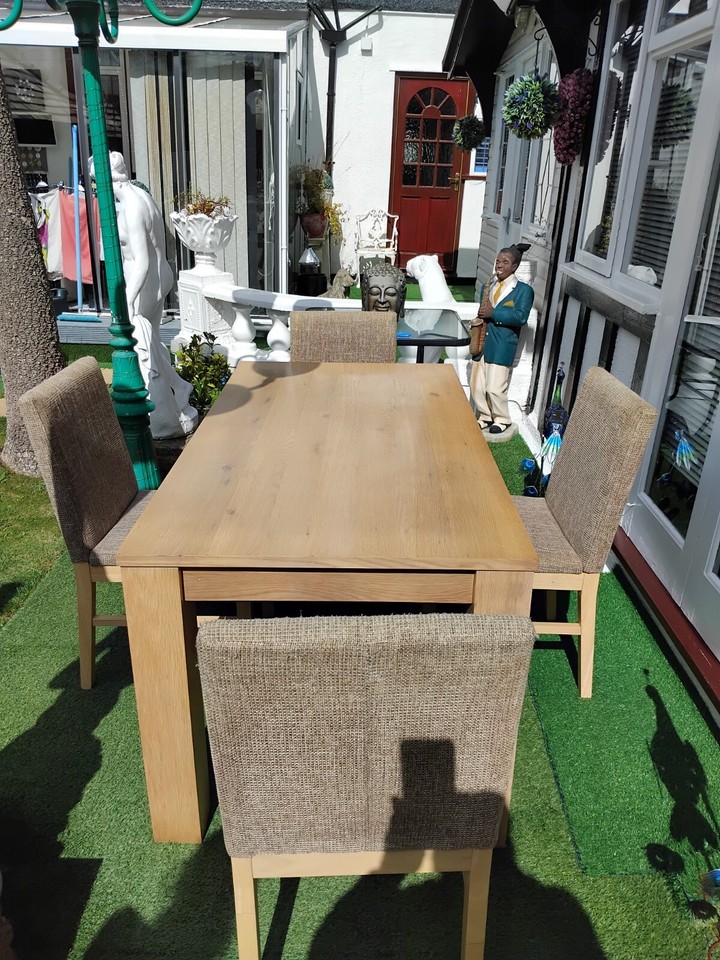 round dining table and 4 chairs used light oak size 5 foot x 2foot 8