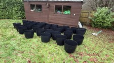 32 x large outside plant pots.  Whitefurze 50cm Large Barrel Planters Black