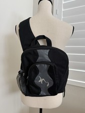 Black Sling Backpack with Two Zip Pockets.