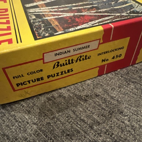 Yellow Built Rite box with red text “Indian Summer,” interlocking line art, and “No. 450” on wooden surface.