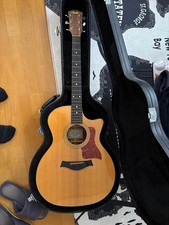 Taylor 314-CE acoustic guitar with genuine hard case