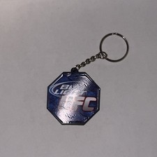 UFC X BUDLIGHT OCTAGON SHAPED KEYCHAIN BLACK AND BLUE