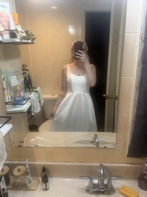 Wedding Dress and Train Size 4 with Pearls and Rhinestones as well as pockets